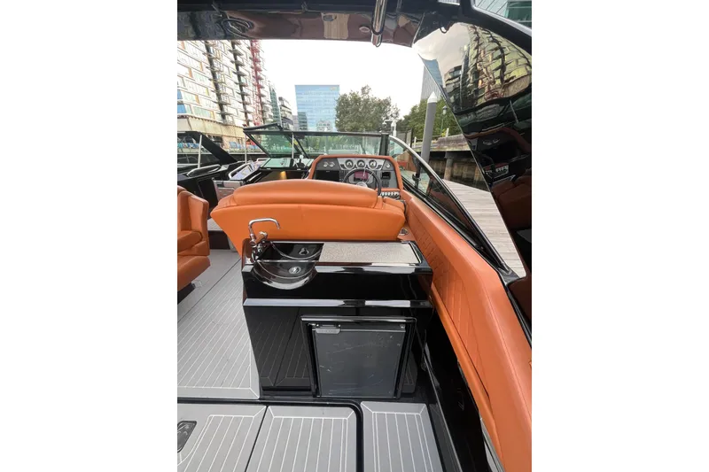 Slide: The Image of 2022 Cruisers Yachts 338 South Beach Edition Bow Rider interior with luxurious seating and sleek design. - 29