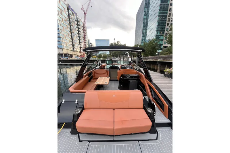 Slide: The Image of 2022 Cruisers Yachts 338 South Beach Edition Bow Rider docked in urban marina. - 34