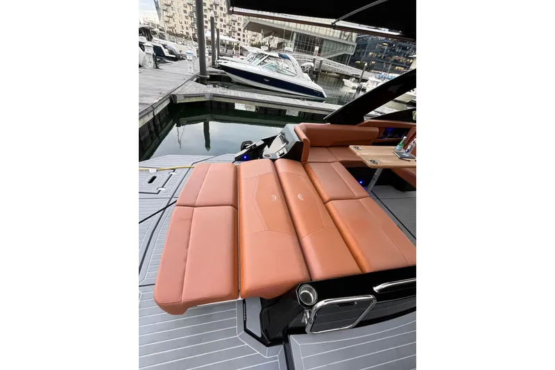 Slide: The Image of 2022 Cruisers Yachts 338 South Beach Edition Bow Rider with luxurious seating at marina. - 35