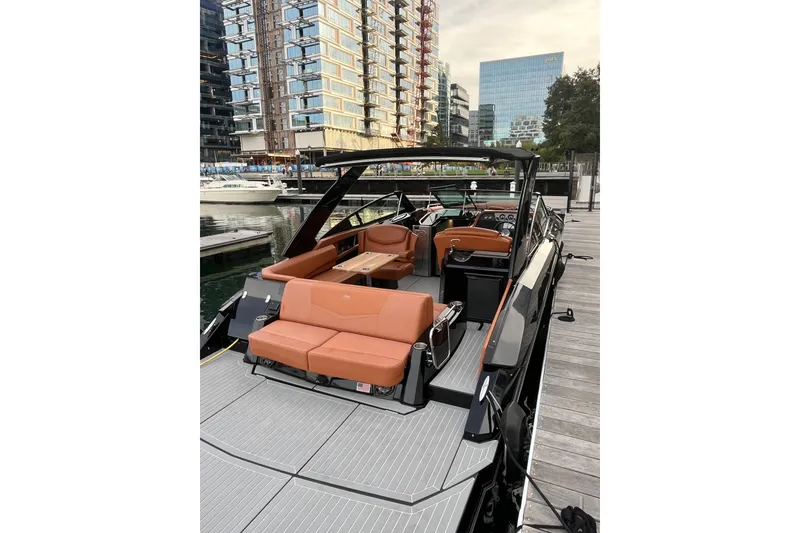 Slide: The Image of 2022 Cruisers Yachts 338 South Beach Edition Bow Rider docked in urban marina. - 37