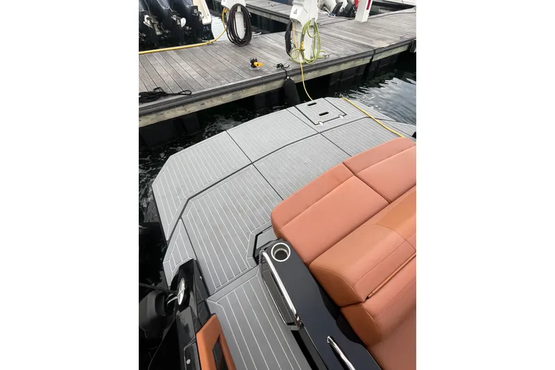 Slide: The Image of 2022 Cruisers Yachts 338 South Beach Edition Bow Rider at dock, featuring sleek seating. - 39