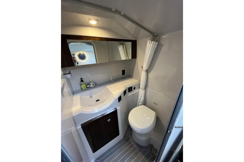 Slide: The Image of 2022 Cruisers Yachts 338 South Beach Edition Bow Rider bathroom interior with modern fixtures. - 45