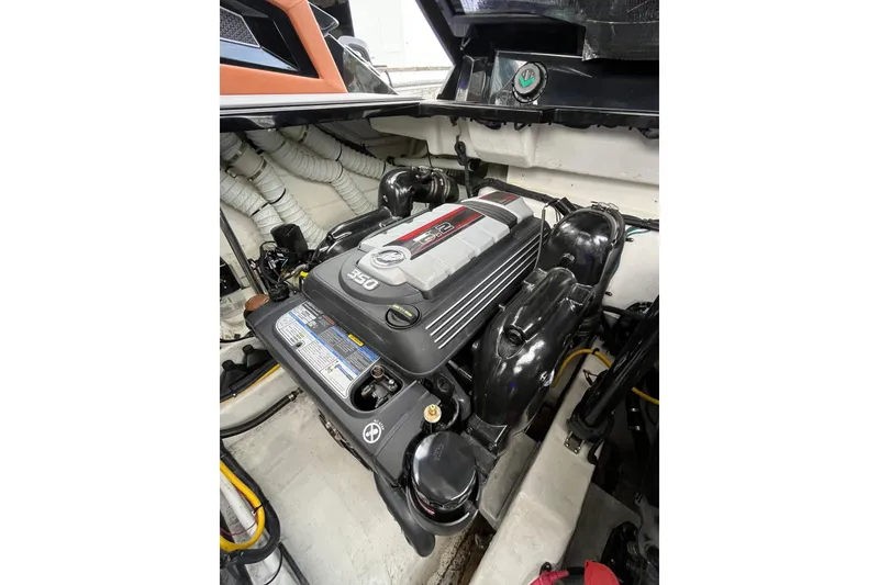 Slide: The Image of Engine compartment of 2022 Cruisers Yachts 338 South Beach Edition Bow Rider. - 54