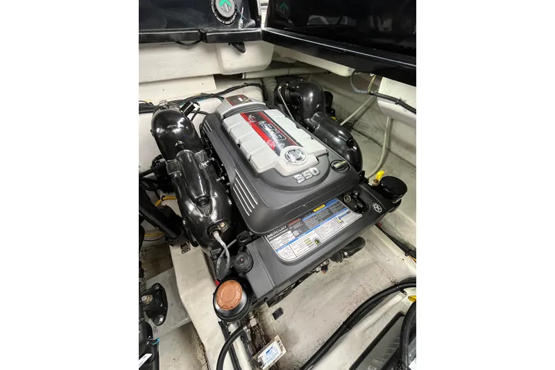 Slide: The Image of Engine compartment of 2022 Cruisers Yachts 338 South Beach Edition Bow Rider. - 55