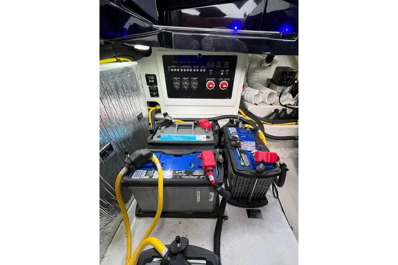 Slide: The Image of 2022 Cruisers Yachts 338 South Beach Edition Bow Rider battery compartment with control panel. - 56