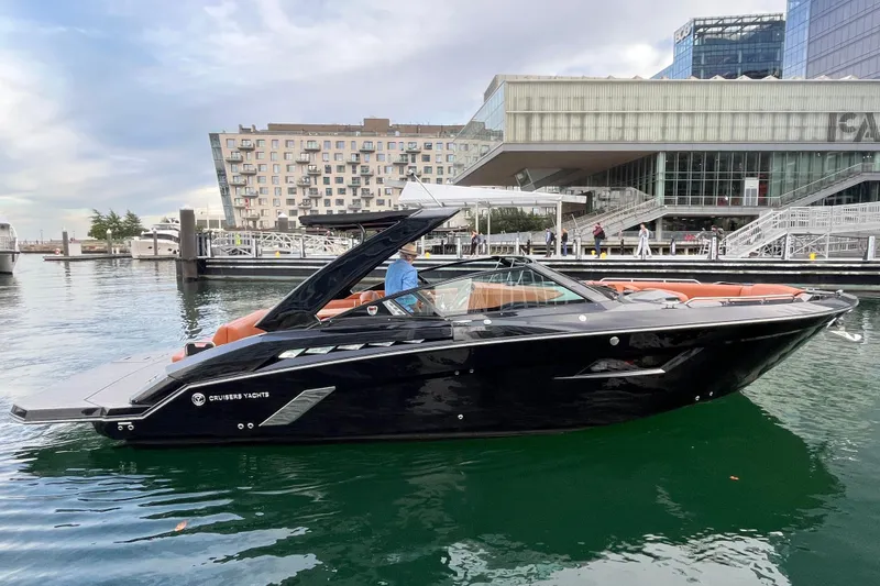 Slide: The Image of 2022 Cruisers Yachts 338 South Beach Edition Bow Rider docked in urban marina. - 9