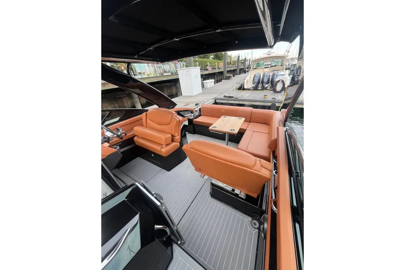 Slide: The Image of 2022 Cruisers Yachts 338 South Beach Edition Bow Rider with luxurious seating and sleek design. - 22