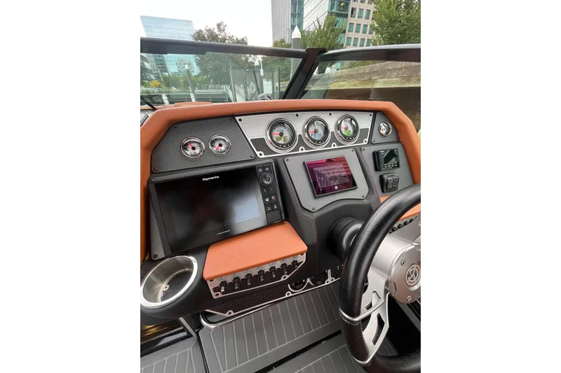 Slide: The Image of 2022 Cruisers Yachts 338 South Beach Edition Bow Rider dashboard with modern navigation instruments. - 27