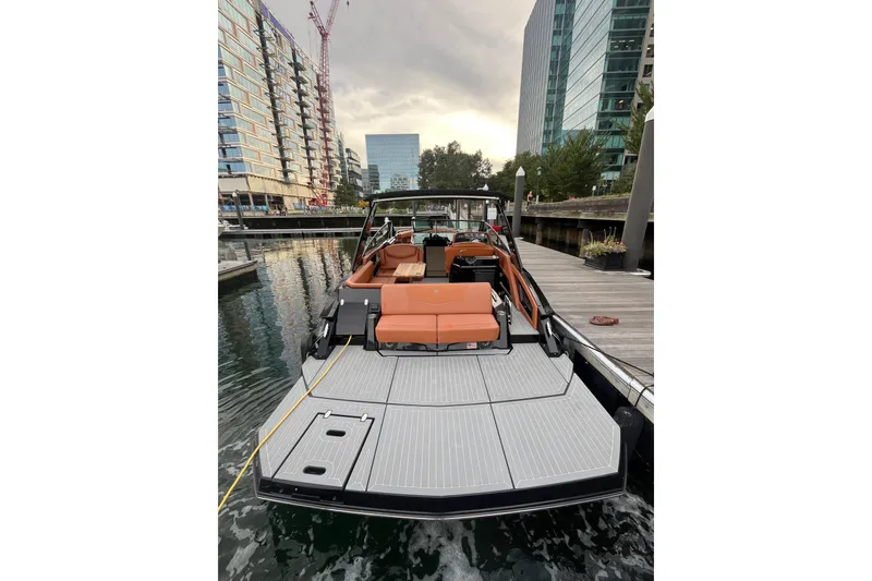 Slide: The Image of 2022 Cruisers Yachts 338 South Beach Edition Bow Rider docked in urban marina. - 38
