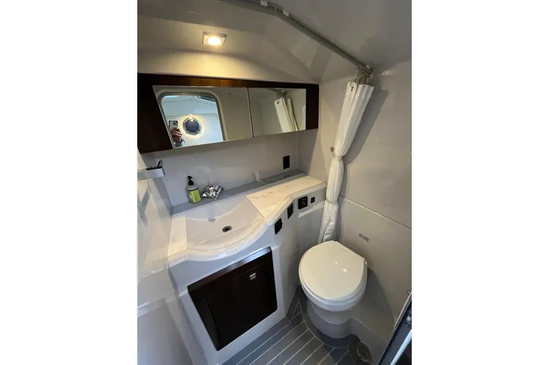 Slide: The Image of 2022 Cruisers Yachts 338 South Beach Edition Bow Rider bathroom interior with modern fixtures. - 44