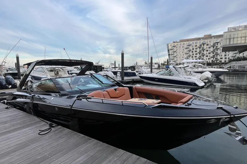 Slide: The Image of 2022 Cruisers Yachts 338 South Beach Edition Bow Rider docked at marina. - 5