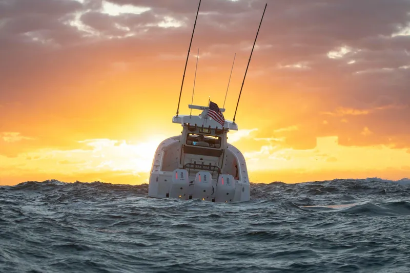 Slide: The Image of Solace 35 CS boat at sunset on ocean waves, 2026 model. - 4