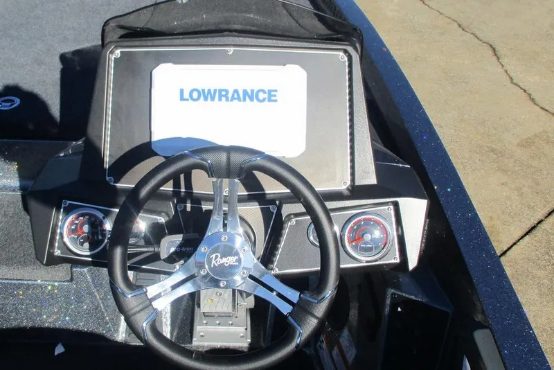 Slide: The Image of 2026 Ranger Z519 Ranger Cup Equipped boat dashboard with Lowrance display and steering wheel. - 4