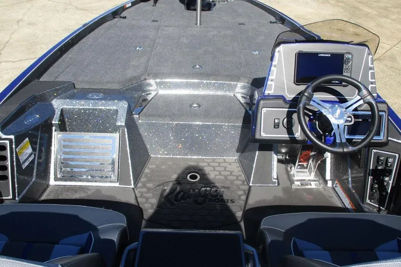 Slide: The Image of 2026 Ranger Z519 Ranger Cup Equipped boat interior with steering wheel and control panel. - 6