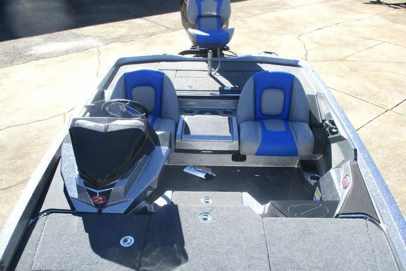 Slide: The Image of 2026 Ranger Z519 Ranger Cup Equipped boat interior with blue and gray seating. - 8