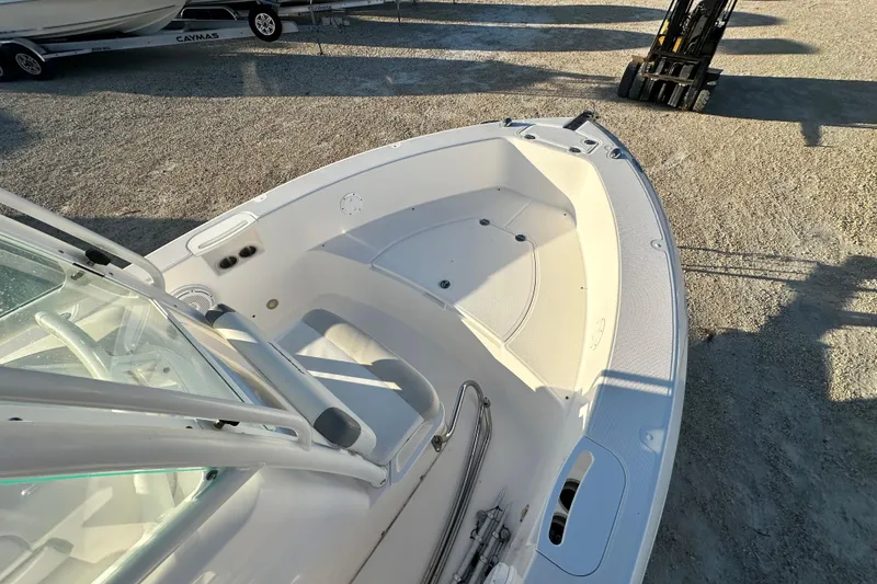 Slide: The Image of 2009 Everglades 230 Center Console boat interior, featuring spacious seating and clean design. - 11