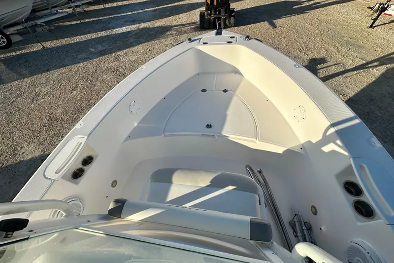 Slide: The Image of 2009 Everglades 230 Center Console boat interior, featuring spacious seating and storage. - 8