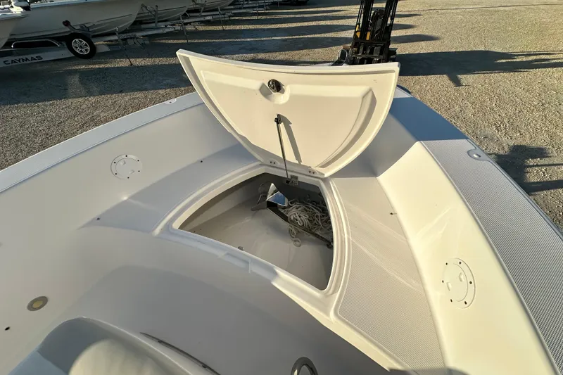 Slide: The Image of Open storage compartment on 2009 Everglades 230 Center Console boat. - 9