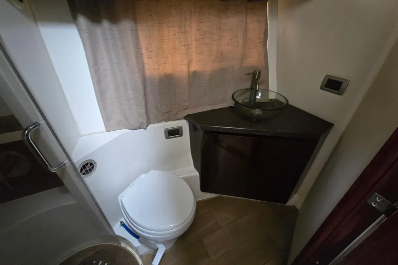 Slide: The Image of Bathroom interior of 2016 Sea Ray 400 Fly yacht with modern fixtures. - 16