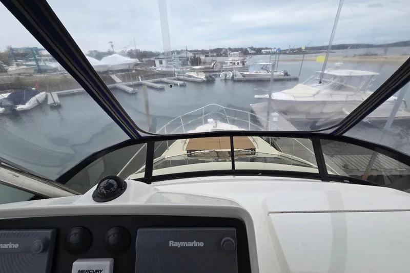 Slide: The Image of Cockpit view from 2016 Sea Ray 400 Fly yacht in marina setting. - 24