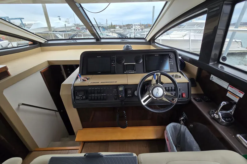 Slide: The Image of Helm of 2016 Sea Ray 400 Fly yacht with modern controls and navigation equipment. - 3