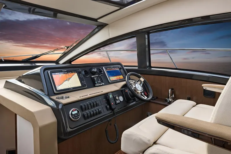 Slide: The Image of Manufacturer Provided Image: Helm of 2016 Sea Ray 400 Fly yacht with navigation screens at sunset. - 4