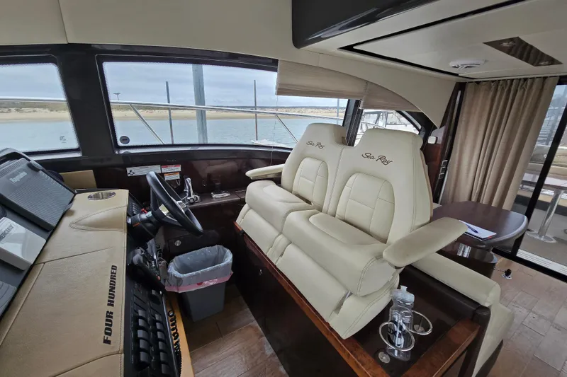 Slide: The Image of Interior of 2016 Sea Ray 400 Fly yacht with luxurious seating and helm. - 8