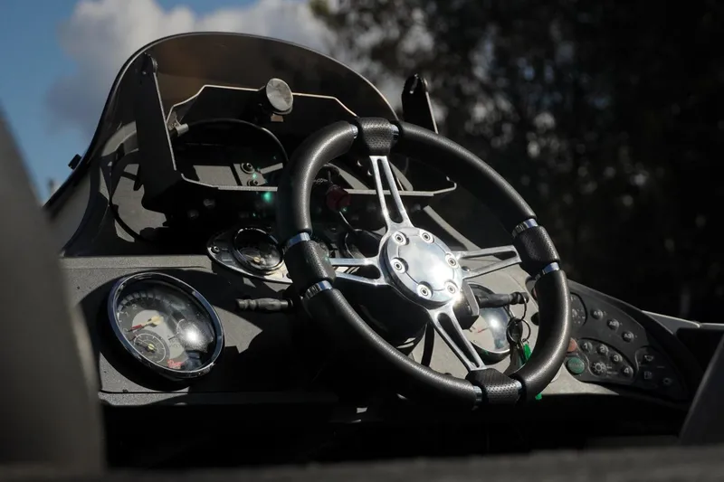 Slide: The Image of 2008 Ranger Z520 Comanche Ranger Cup boat dashboard with steering wheel and gauges. - 13