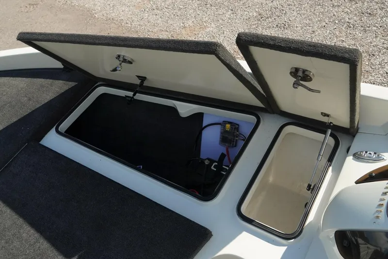 Slide: The Image of 2008 Ranger Z520 Comanche Ranger Cup boat storage compartments open, showing interior details. - 23