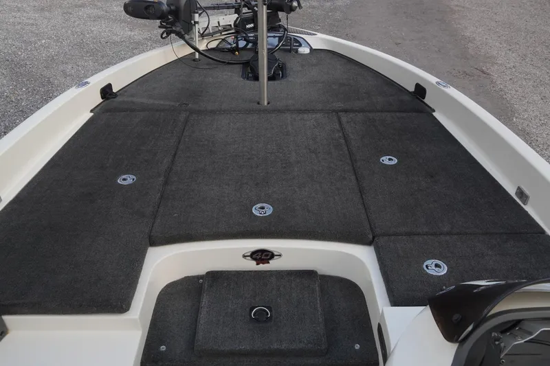 Slide: The Image of 2008 Ranger Z520 Comanche Ranger Cup boat deck with carpeted surface and storage compartments. - 25