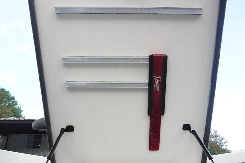 Slide: The Image of 2008 Ranger Z520 Comanche Ranger Cup boat storage compartment with measuring tool. - 33