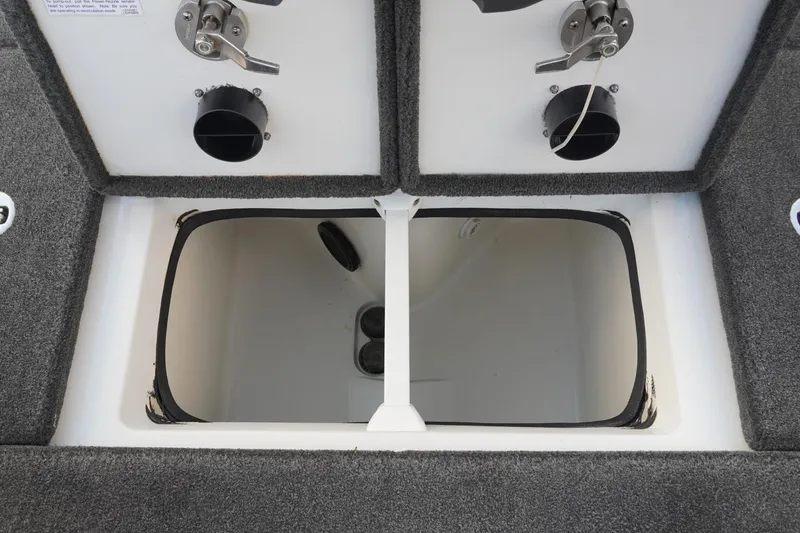 Slide: The Image of 2008 Ranger Z520 Comanche Ranger Cup boat storage compartment with dual latches and carpeted interior. - 36