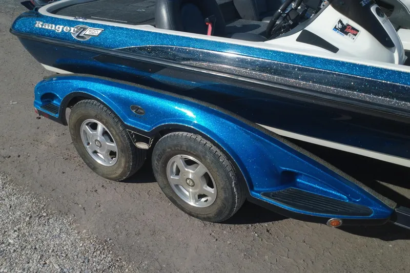 Slide: The Image of 2008 Ranger Z520 Comanche Ranger Cup boat with blue metallic finish and dual-axle trailer. - 7