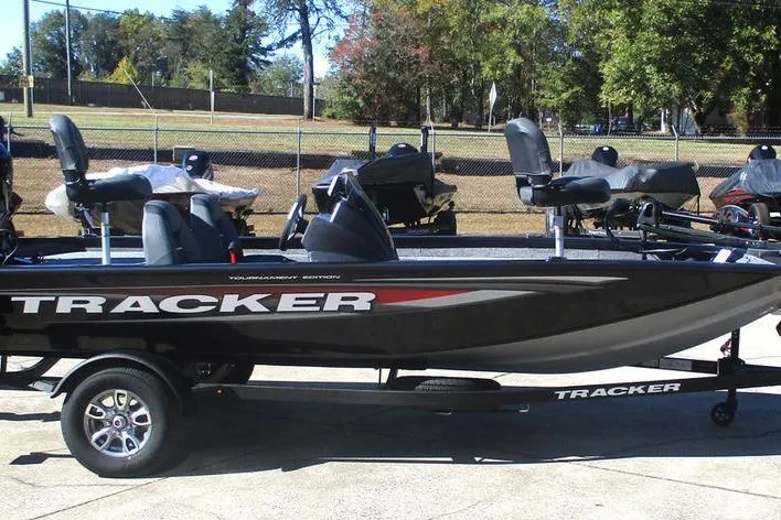 Slide: The Image of 2026 Tracker Pro Team 175 boat on trailer, parked outdoors. - 3