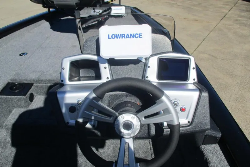 Slide: The Image of 2026 Tracker Pro Team 175 boat dashboard with Lowrance electronics and steering wheel. - 4