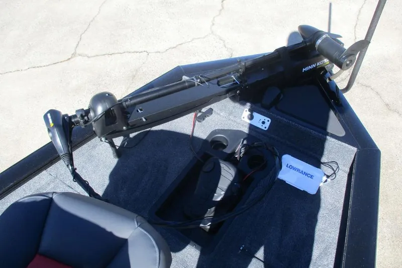 Slide: The Image of 2026 Tracker Pro Team 175 boat deck with Minn Kota trolling motor and Lowrance electronics. - 8