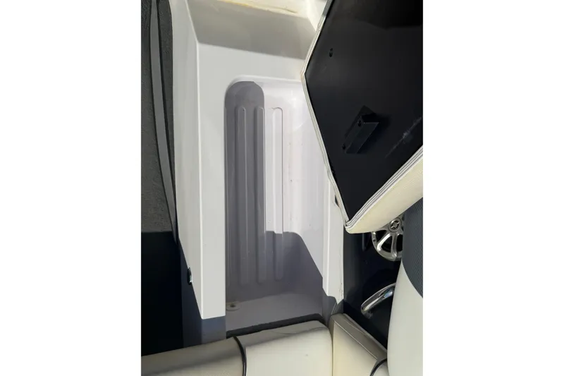 Slide: The Image of 2012 Moomba Mobius LSV boat interior storage compartment with open lid. - 14