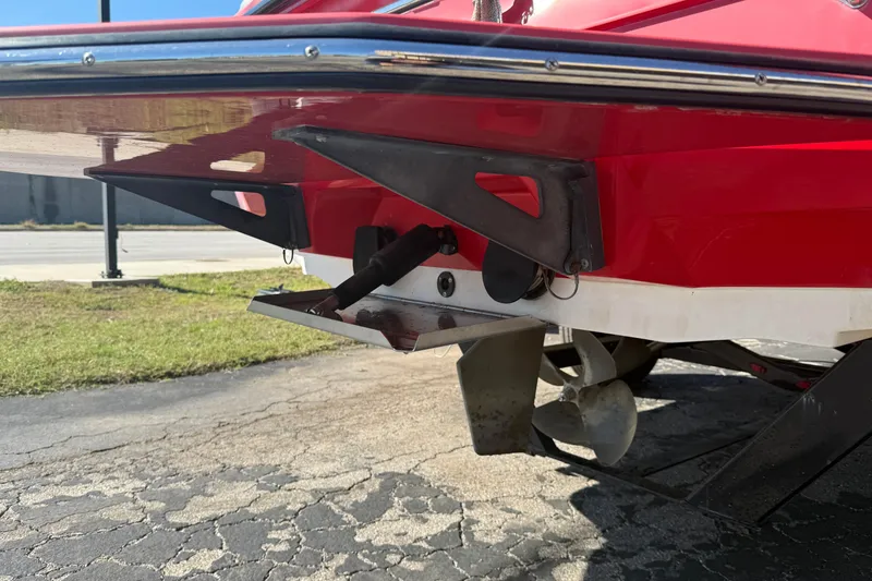 Slide: The Image of 2012 Moomba Mobius LSV boat rear view with propeller and trim tab. - 5