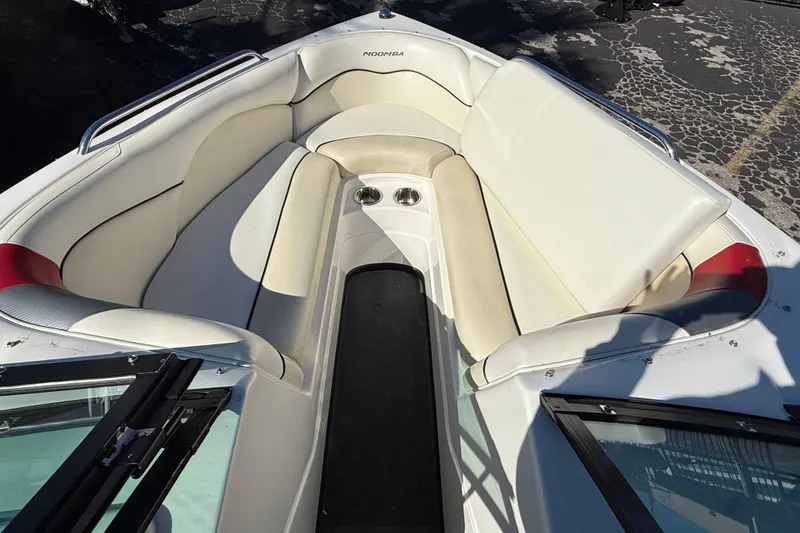 Slide: The Image of 2012 Moomba Mobius LSV boat interior with white seating and cup holders. - 7