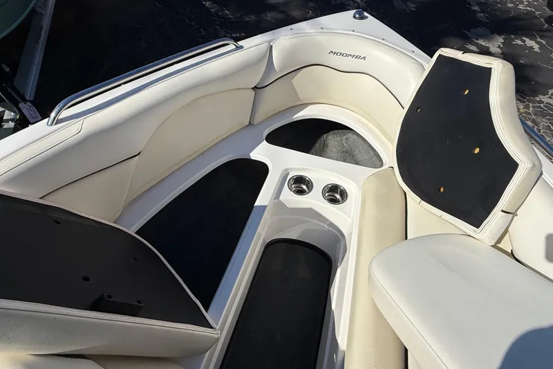 Slide: The Image of 2012 Moomba Mobius LSV boat interior with white seating and cup holders. - 9