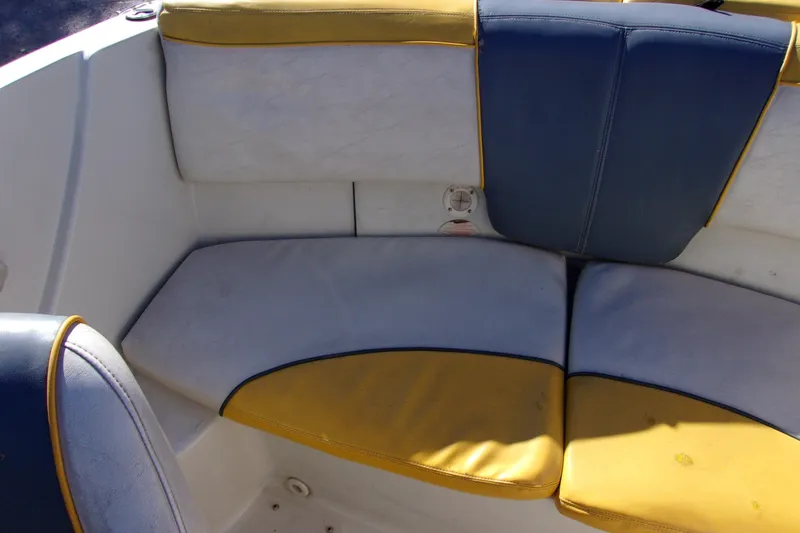 Slide: The Image of 2007 Sea Ray 185 Sport boat interior with blue and yellow seating. - 10