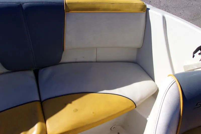 Slide: The Image of 2007 Sea Ray 185 Sport boat interior with blue and yellow seating. - 11