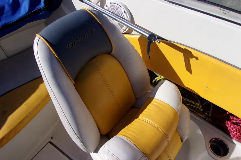 Slide: The Image of 2007 Sea Ray 185 Sport boat seat with yellow and gray upholstery. - 8