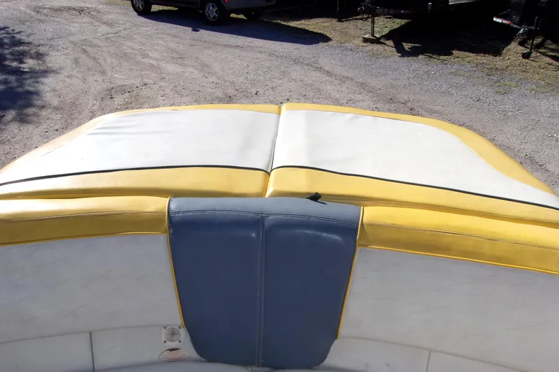 Slide: The Image of 2007 Sea Ray 185 Sport boat interior with yellow and white upholstery. - 9