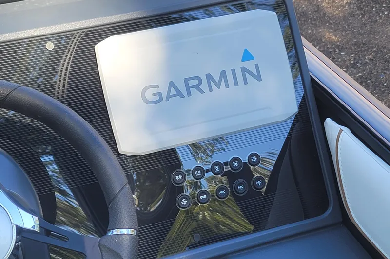 Slide: The Image of Dashboard of 2025 Manitou Explore 26 Switchback with Garmin display and controls. - 9