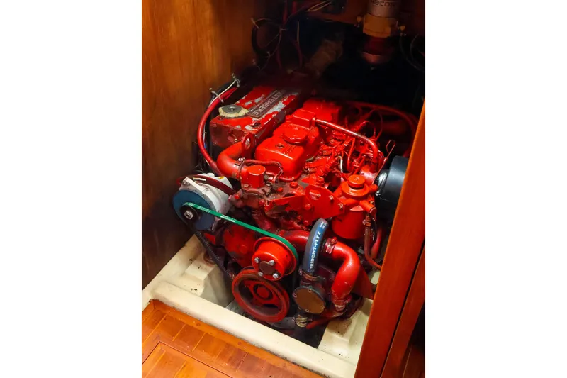 Slide: The Image of Engine of 1985 Bayfield 40 yacht, vibrant red, detailed components visible. - 26