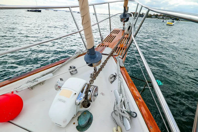 Slide: The Image of Bow of 1985 Bayfield 40 yacht with anchor chain and railing on open water. - 3