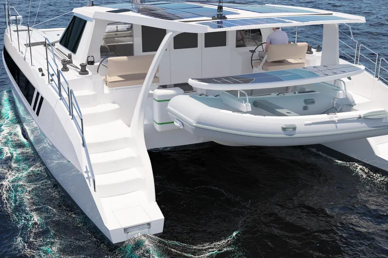 Slide: The Image of 2026 Seawind 1270 catamaran sailing on open water, featuring solar panels and a dinghy. - 14