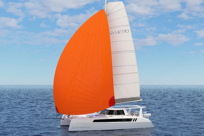 Slide: The Image of 2026 Seawind 1270 catamaran sailing with vibrant orange spinnaker on open sea. - 8