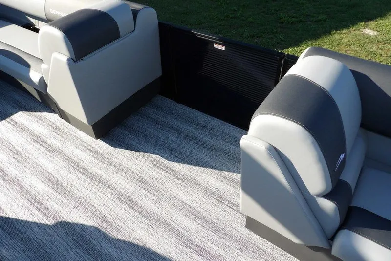 Slide: The Image of 2026 Bennington S L-Bench 22 SL boat interior with gray and black seating. - 12